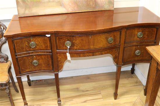 A mahogany inlaid serpentine sideboard, W.138cm